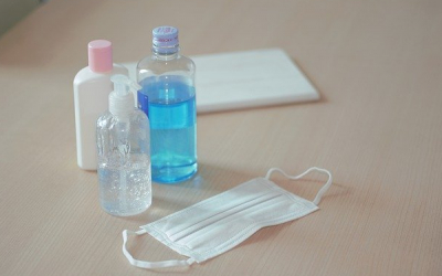 hand sanitizer bottles and mask